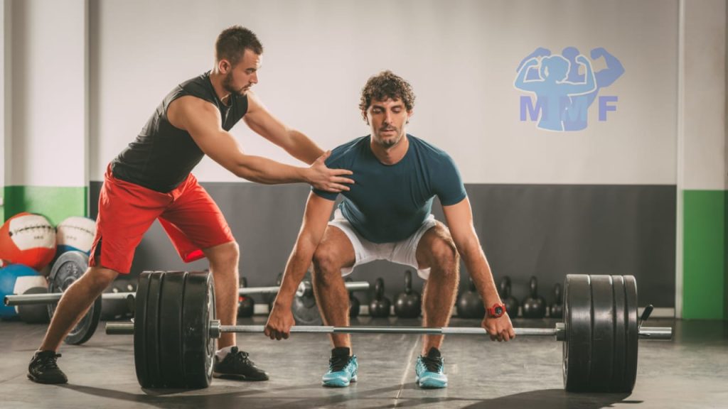 Bad Personal Trainer Trying to Help Client Deadlift.