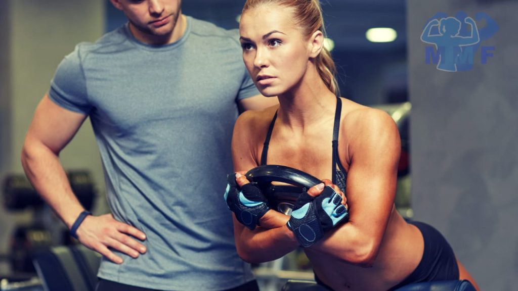woman performing hyperextensions one of the best weighted core exercises.