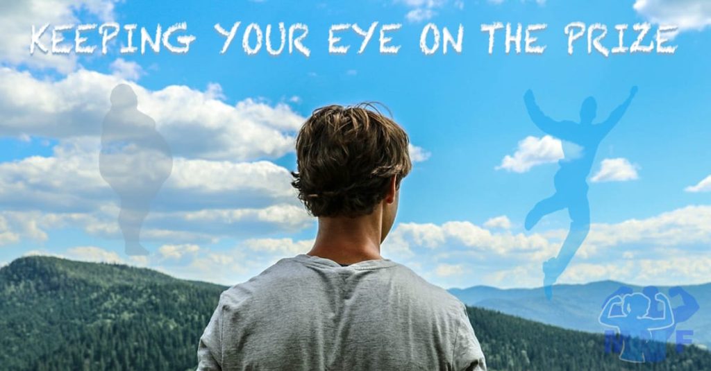 Man looking out over a view of mountains and forests with the Caption "20 Simple Ways to Get and Stay Motivated." for a blog post on how to get motivated.