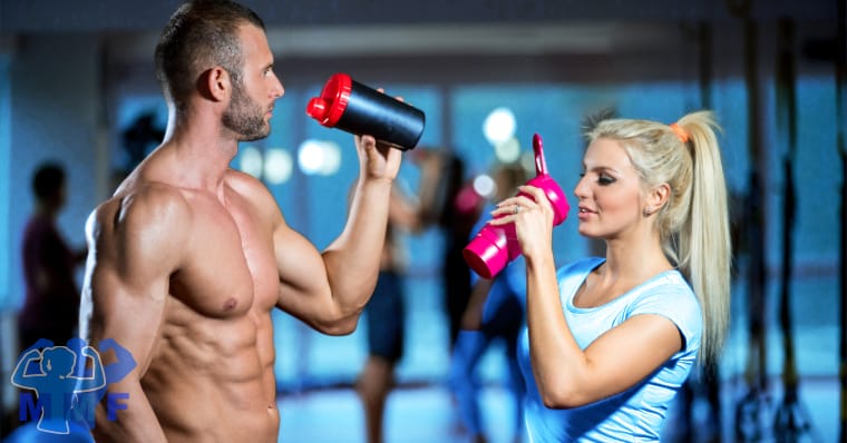 Fit man and woman drinking our of shaker bottles, for protein timing.