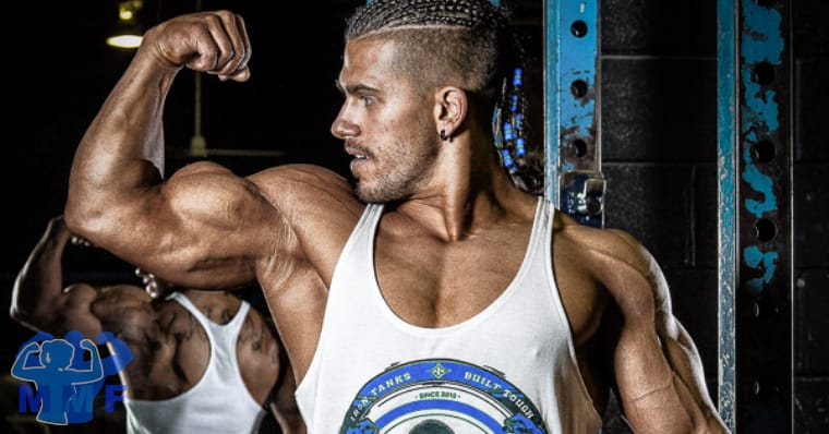 Fit man flexing his biceps after pull arm exercises.