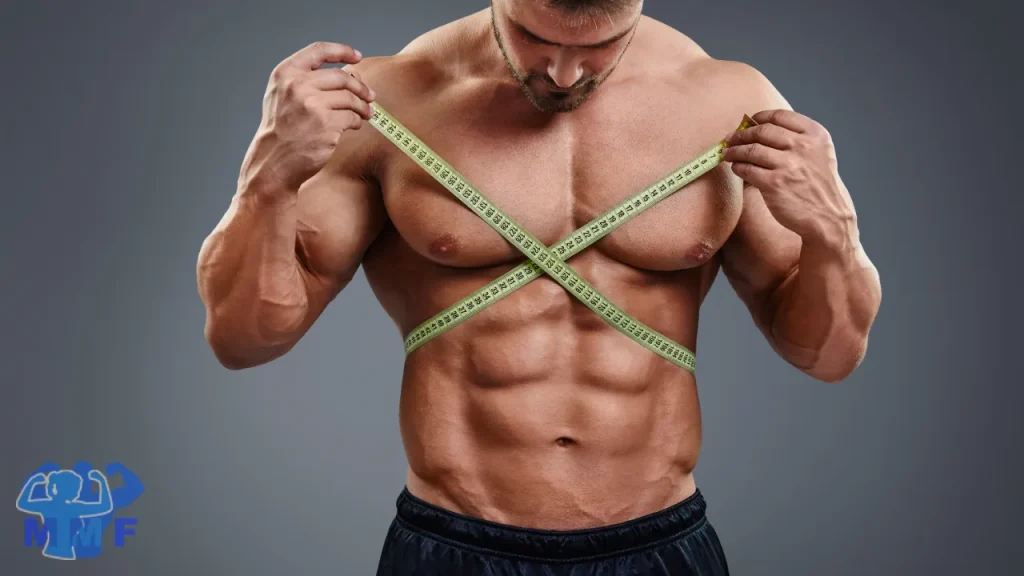 Man with great abs posing with a tailor tape measure.