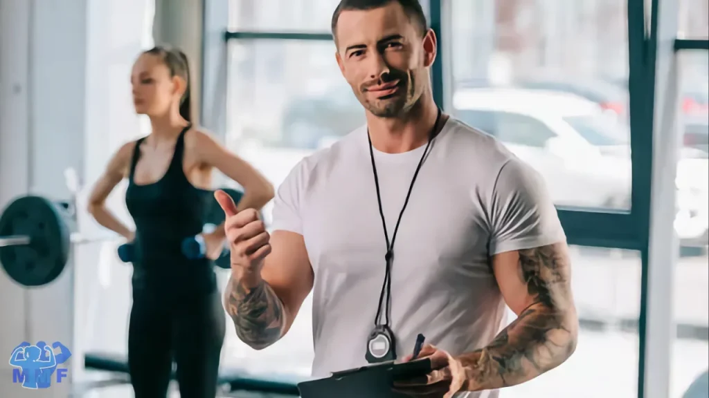 Personal training giving thumbs up after helping a fit woman make realistic goals